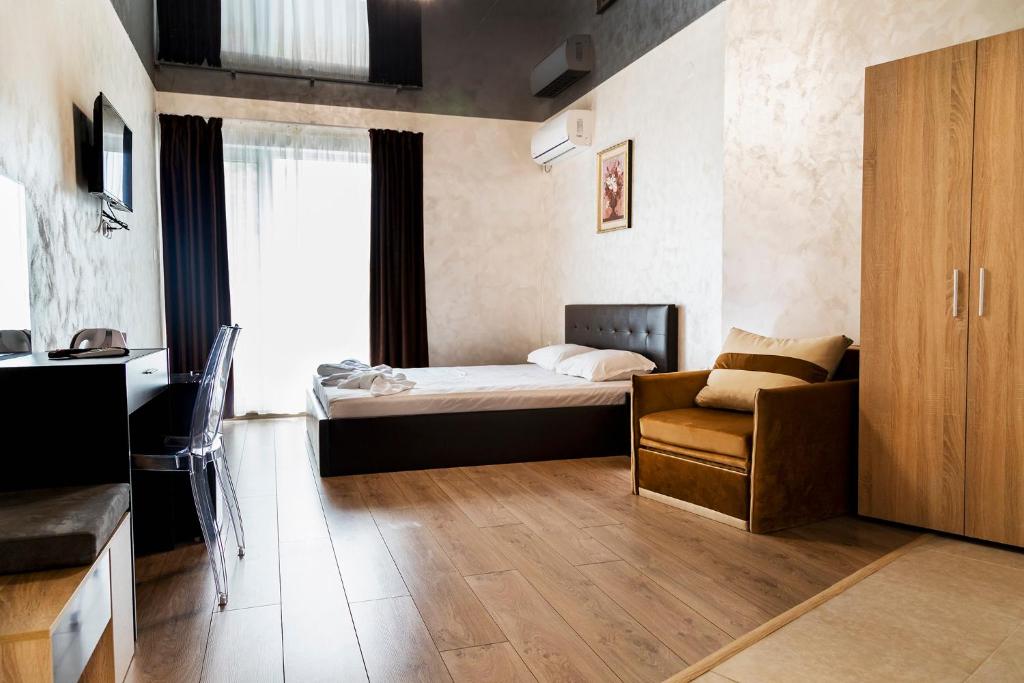 Postel nebo postele na pokoji v ubytování family hotel - City hotel yambol