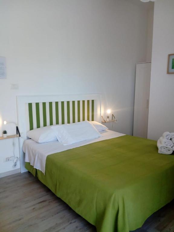 Postel nebo postele na pokoji v ubytování B&B Giallolumia