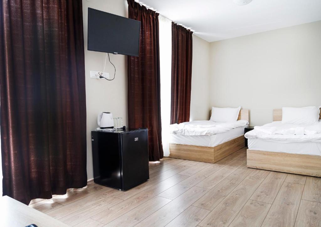 Postel nebo postele na pokoji v ubytování family hotel - City hotel yambol