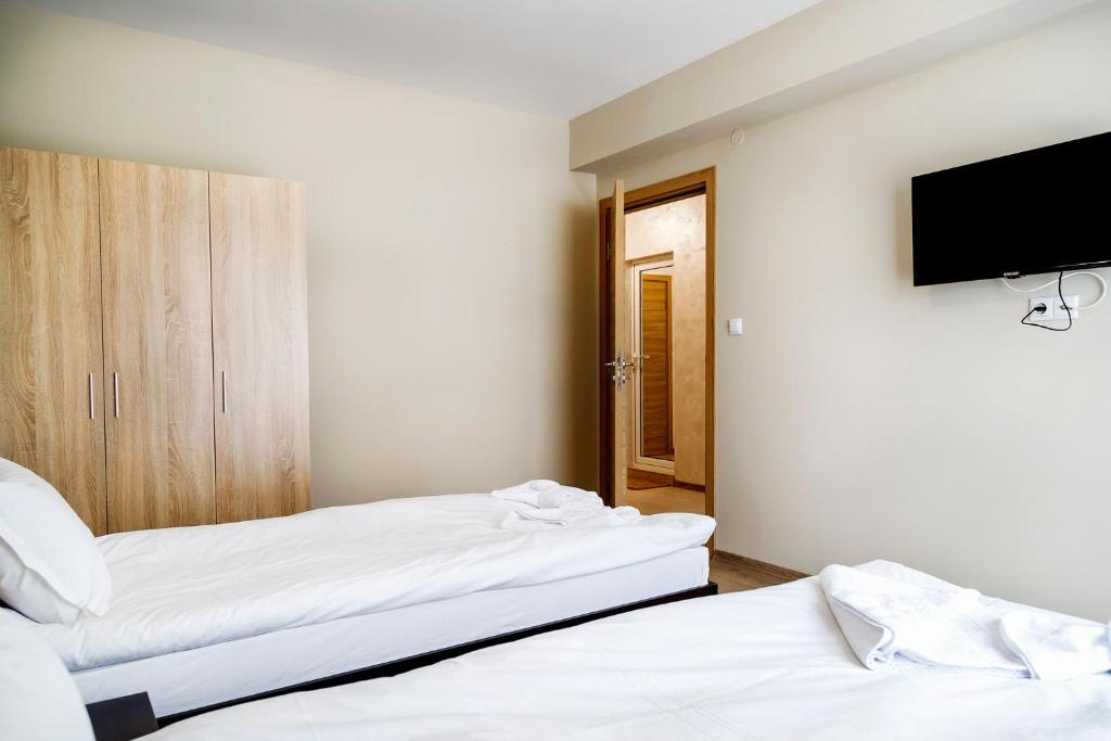 Postel nebo postele na pokoji v ubytování family hotel - City hotel yambol