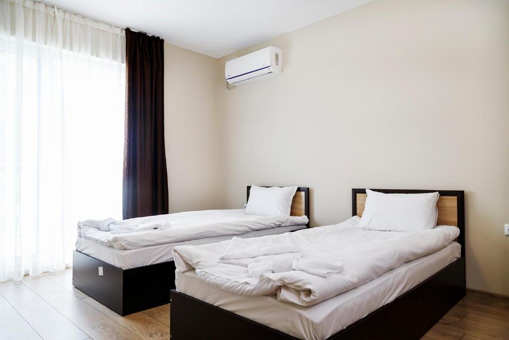 Postel nebo postele na pokoji v ubytování family hotel - City hotel yambol