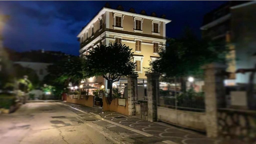 a building on the side of a street at night at Hotel Iris Crillon in Fiuggi