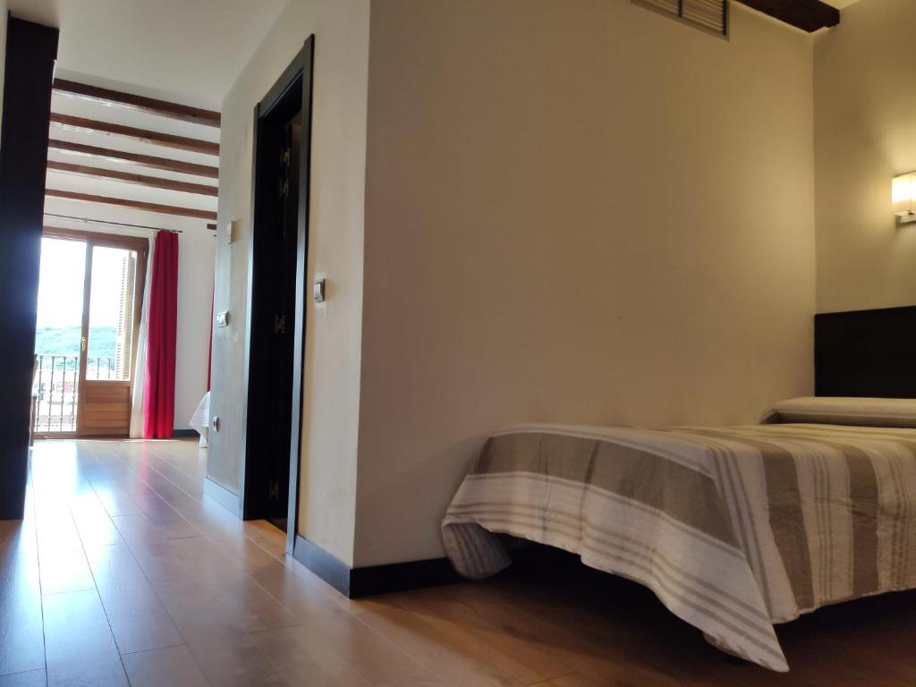 Posteľ alebo postele v izbe v ubytovaní Hotel Rey Sancho
