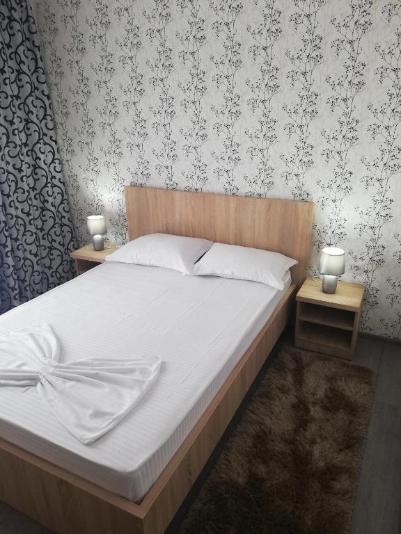 En eller flere senge i et værelse på Vila antonio