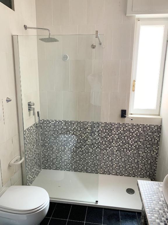 Koupelna v ubytování L'Attico di Piazza Mazzini Rooms