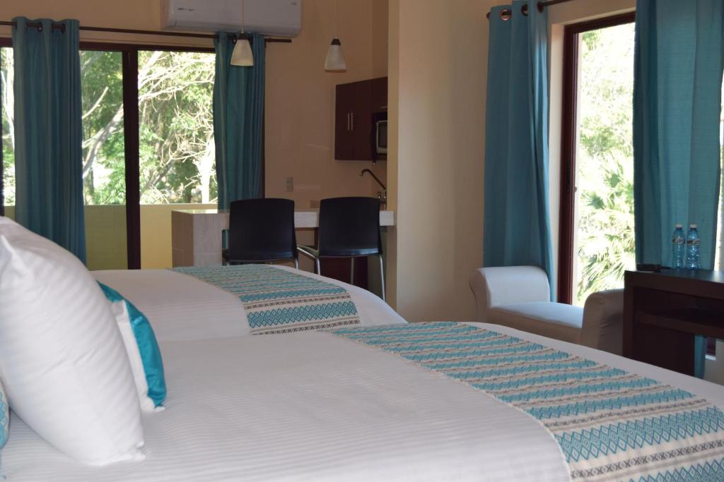 Postel nebo postele na pokoji v ubytování Hotel Chapala Country