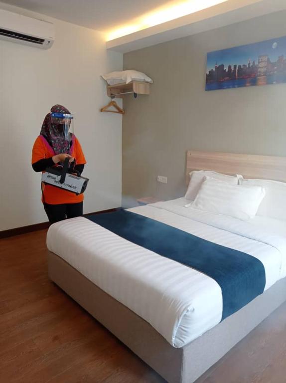 Postel nebo postele na pokoji v ubytování 1 Orange Hotel KLIA & KLIA2