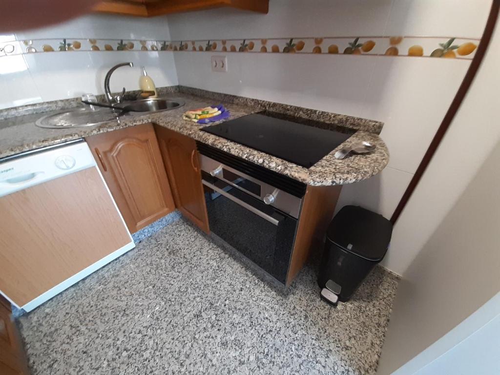 A kitchen or kitchenette at Ático tipo Loft centro de Mugardos