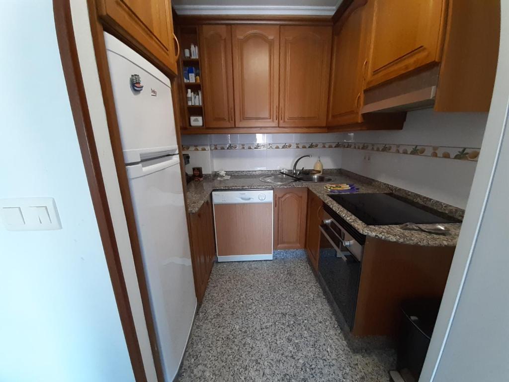A kitchen or kitchenette at Ático tipo Loft centro de Mugardos