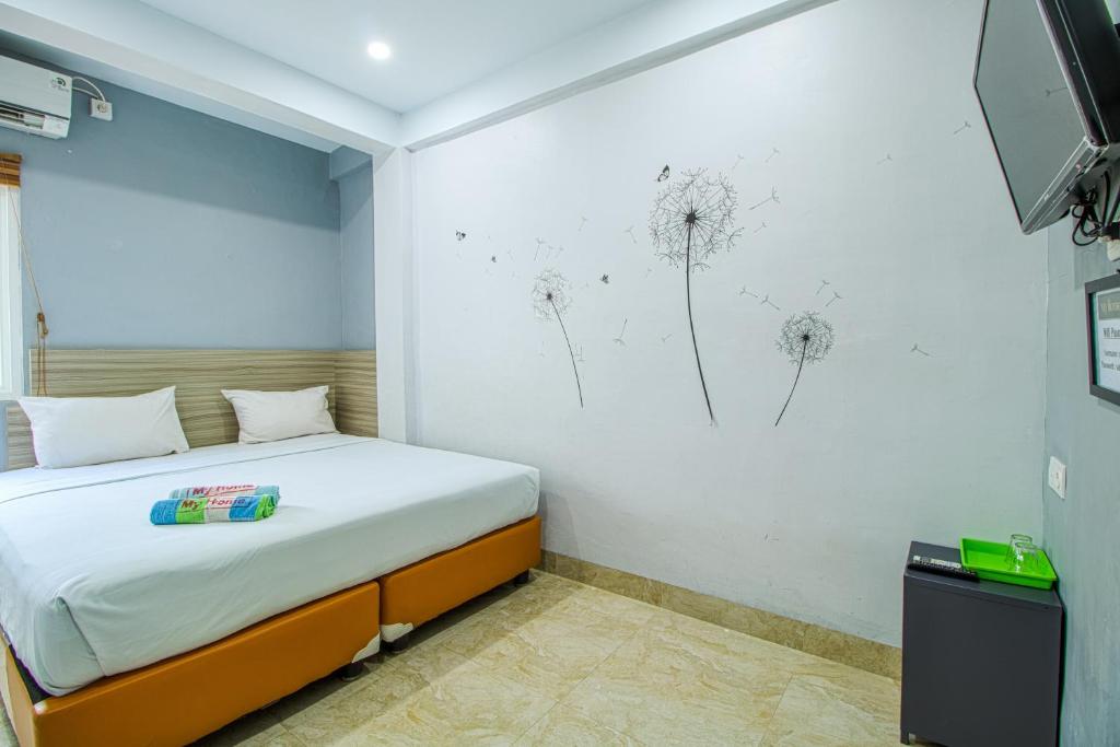 Postel nebo postele na pokoji v ubytování My Home Aceh
