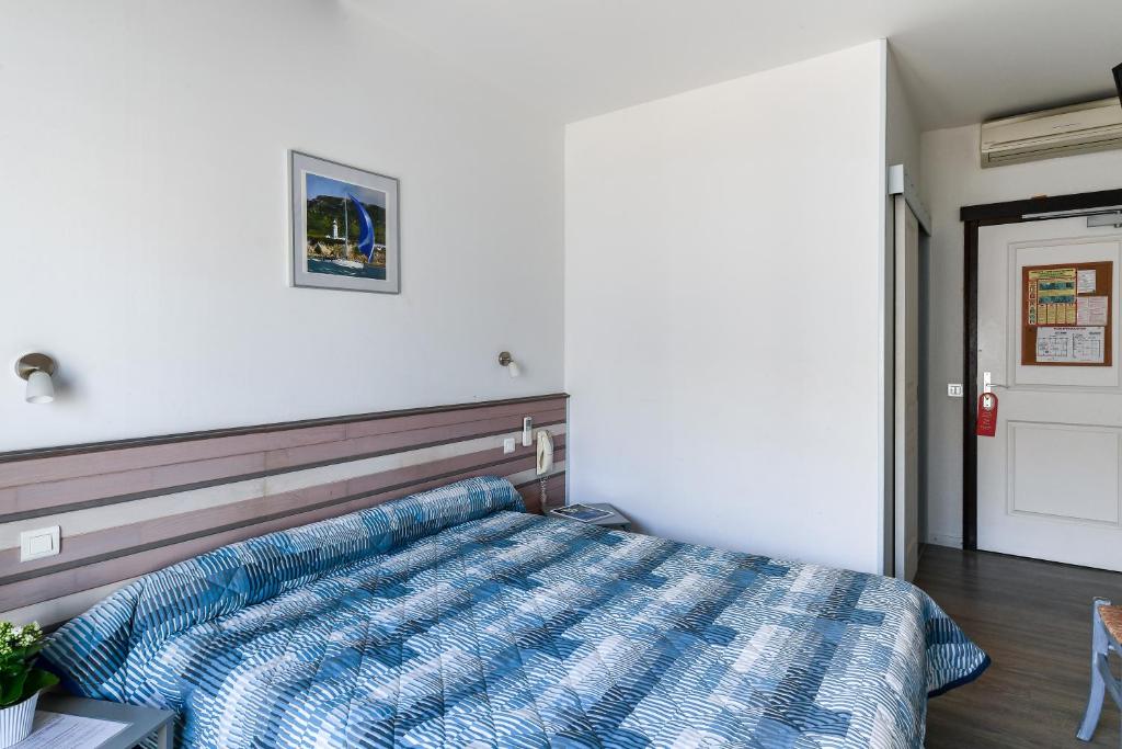 Postel nebo postele na pokoji v ubytování Le Preconil