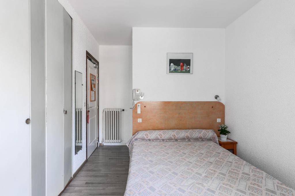 Postel nebo postele na pokoji v ubytování Le Preconil