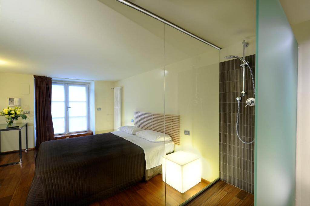 Postel nebo postele na pokoji v ubytování B&B Terres D'Aventure Suites