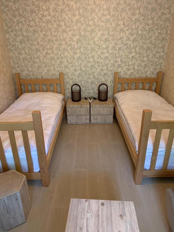 Postel nebo postele na pokoji v ubytování Hotel SHIBI