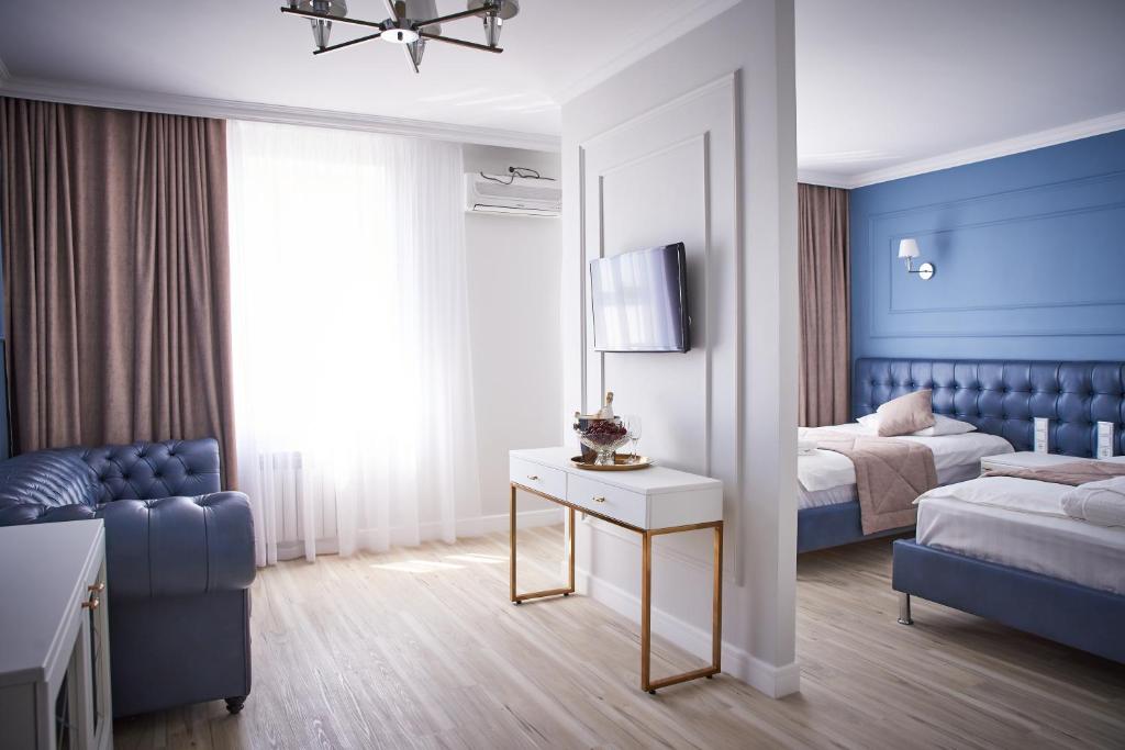 Postel nebo postele na pokoji v ubytování Rakhat Hotel