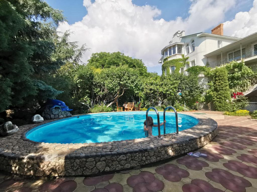 a swimming pool in the yard of a house at Nautilus in Odesa