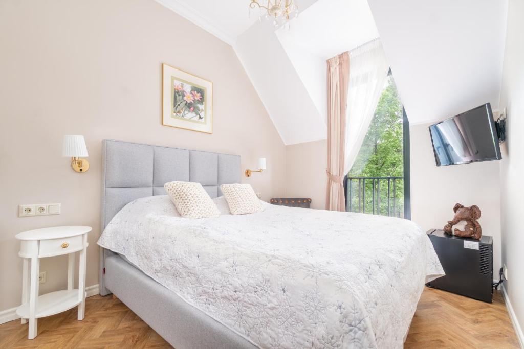 Postel nebo postele na pokoji v ubytování Forums Boutique Hotel