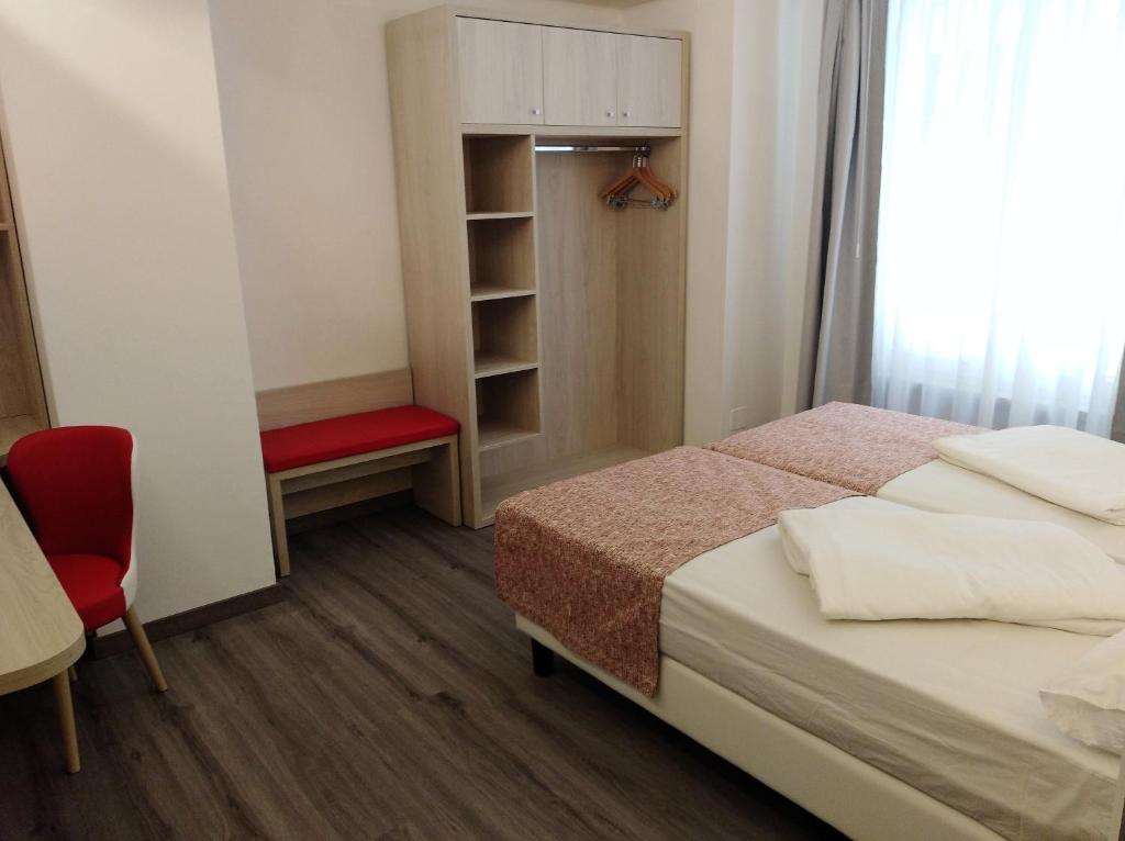 Postel nebo postele na pokoji v ubytování Hotel Orchidea