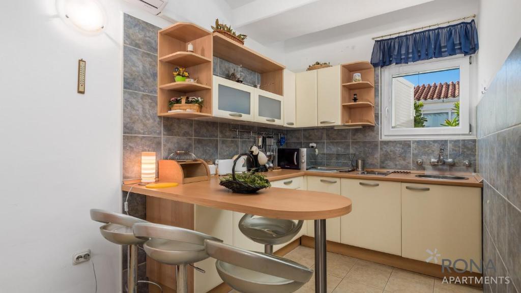 Kuchyň nebo kuchyňský kout v ubytování Rona Apartment Aurora