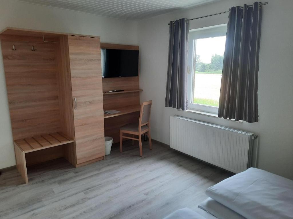Postel nebo postele na pokoji v ubytování Hotel Zur Erholung & Restaurant Amme's Landhaus