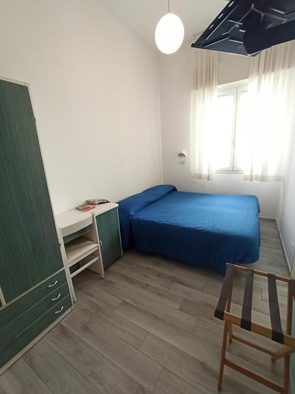 Postel nebo postele na pokoji v ubytování Hotel Marilinda