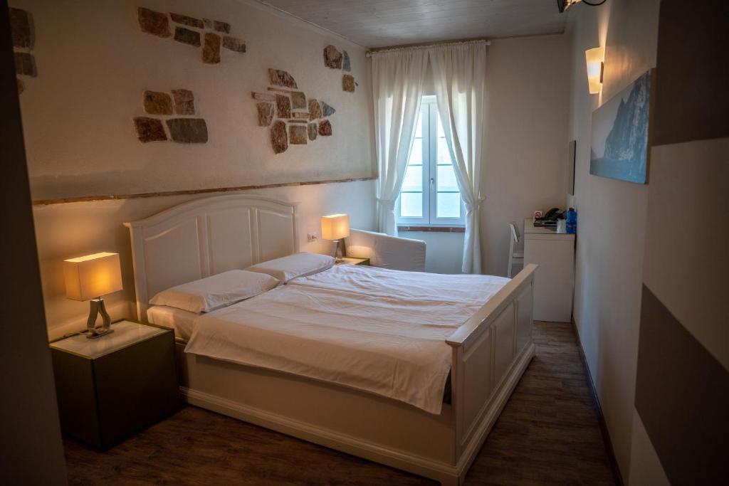 Een bed of bedden in een kamer bij Garni Gianmartin