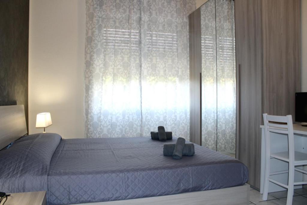 A bed or beds in a room at Cagliari 4u