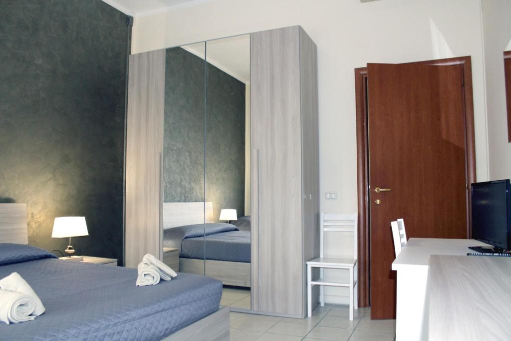 A bed or beds in a room at Cagliari 4u