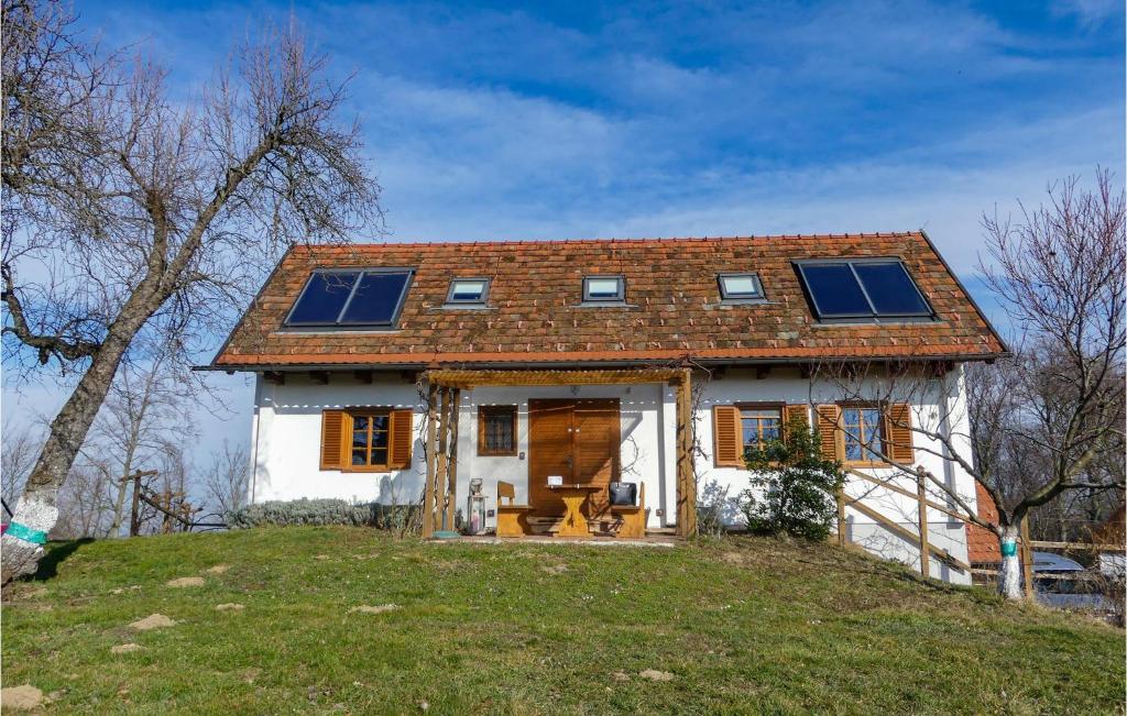 a house with solar panels on top of a hill at Beautiful Home In Strem-sumetendorf With 2 Bedrooms And Wifi in Sumetendorf