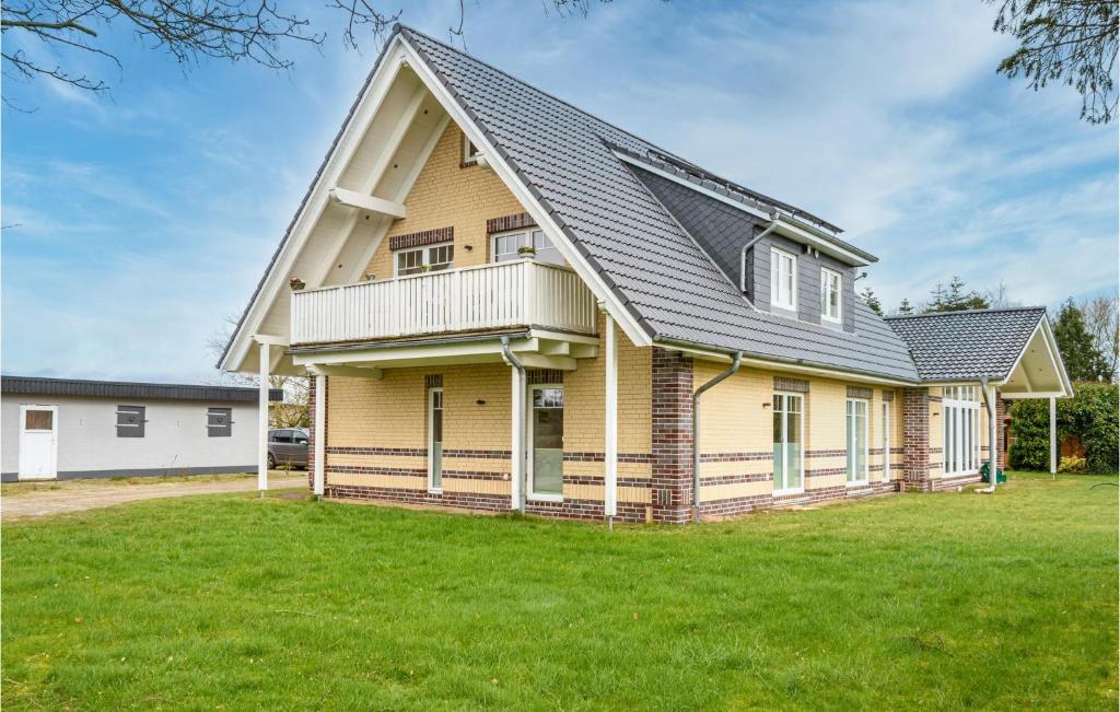 a large house with a gambrel roof at Amazing Apartment In Langenhorn With Kitchen in Langenhorn