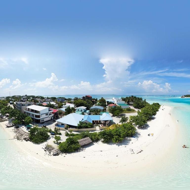 an aerial view of a resort on a beach at Bibee Maldives in Dhiffushi