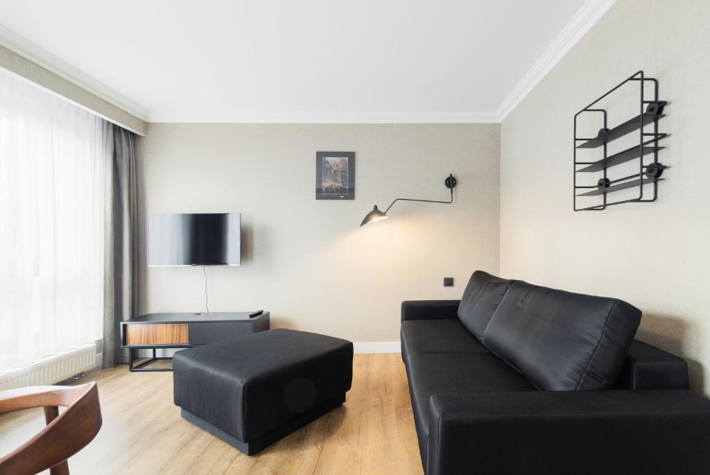 Telewizja i/lub zestaw kina domowego w obiekcie Victoria Residence Apartments by Grand Apartments