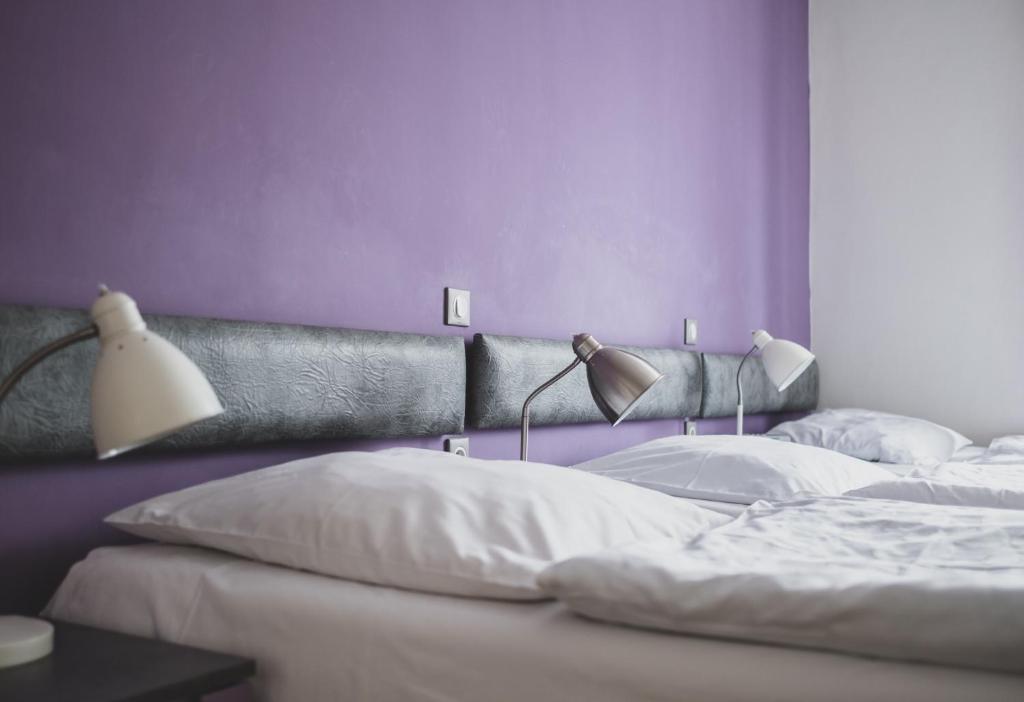 Postel nebo postele na pokoji v ubytování Cybulskiego Guest Rooms