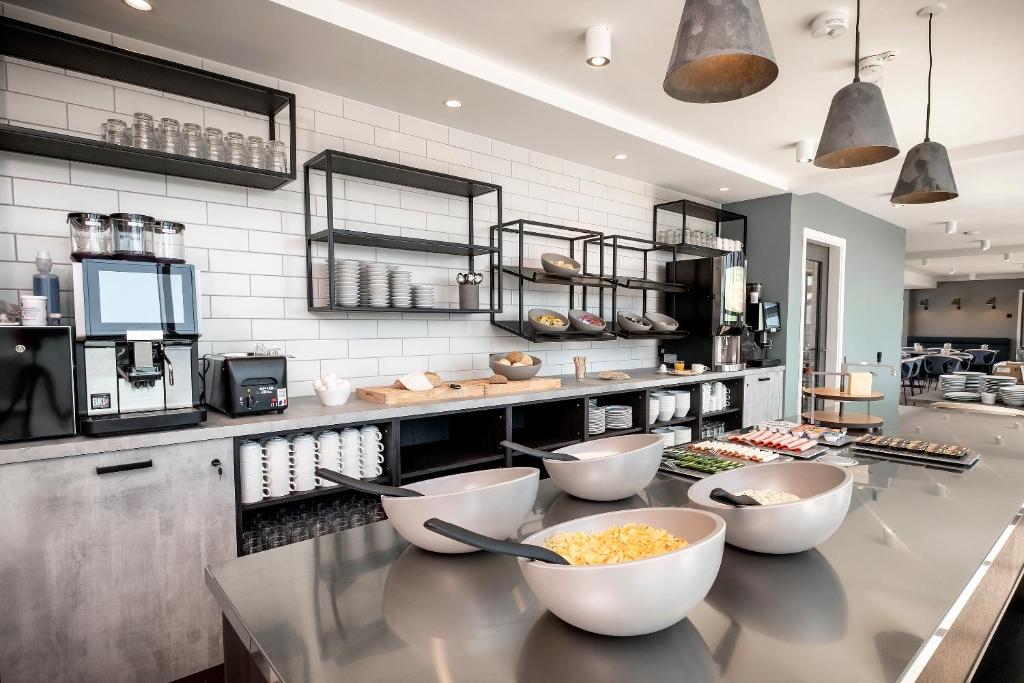 A cozinha ou kitchenette de Go Hotel City
