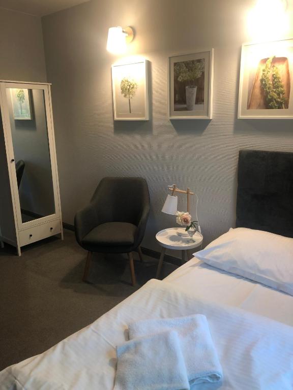 Postel nebo postele na pokoji v ubytování Hotel Portus