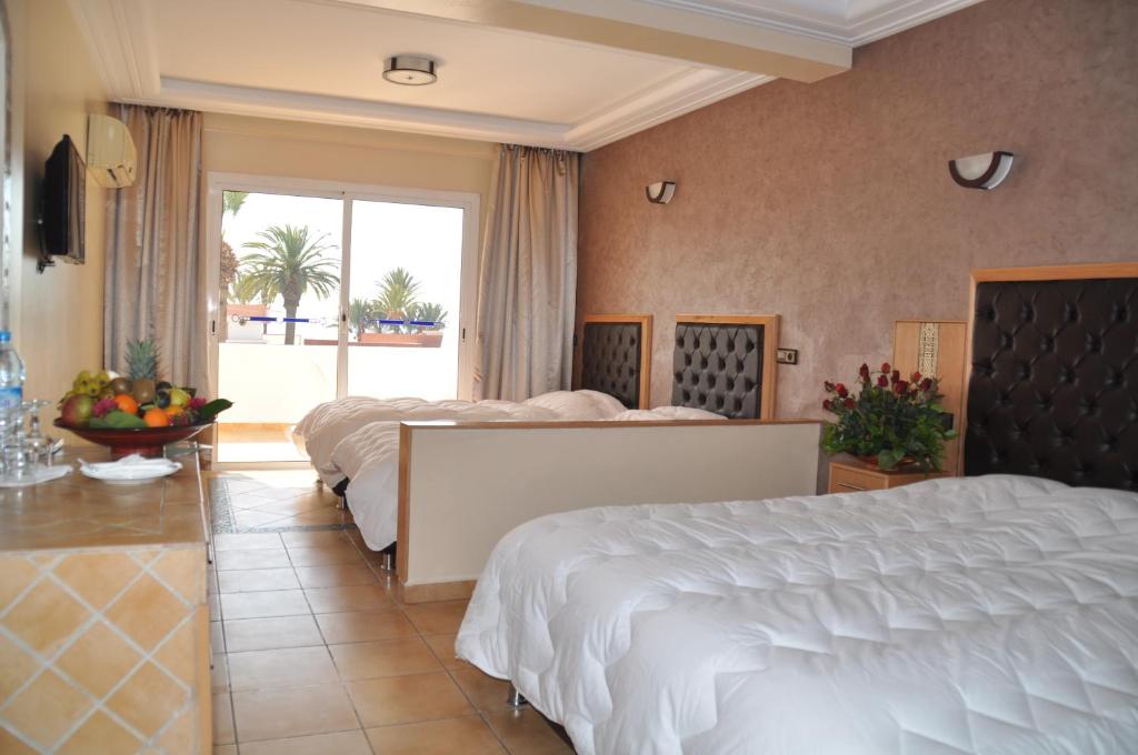 Postel nebo postele na pokoji v ubytování Hotel Club Almoggar Garden Beach
