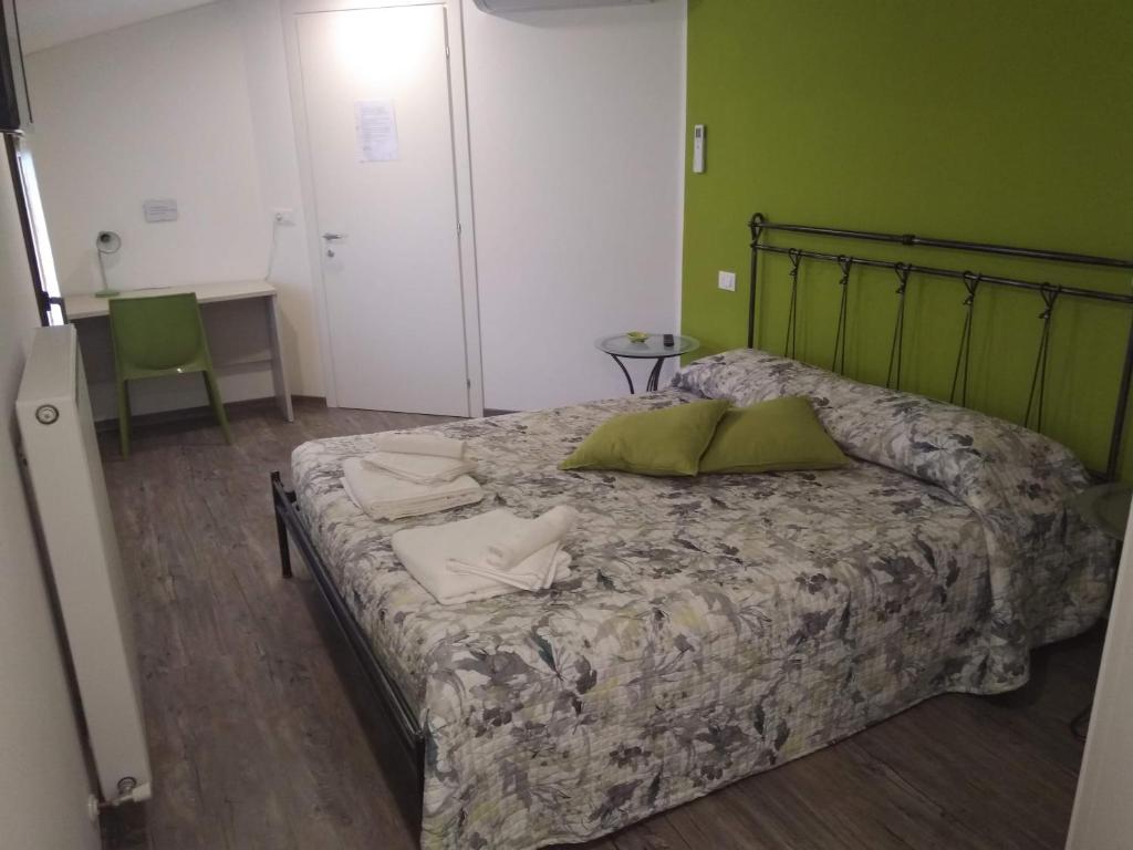 Postel nebo postele na pokoji v ubytování B&B NONO TILIO