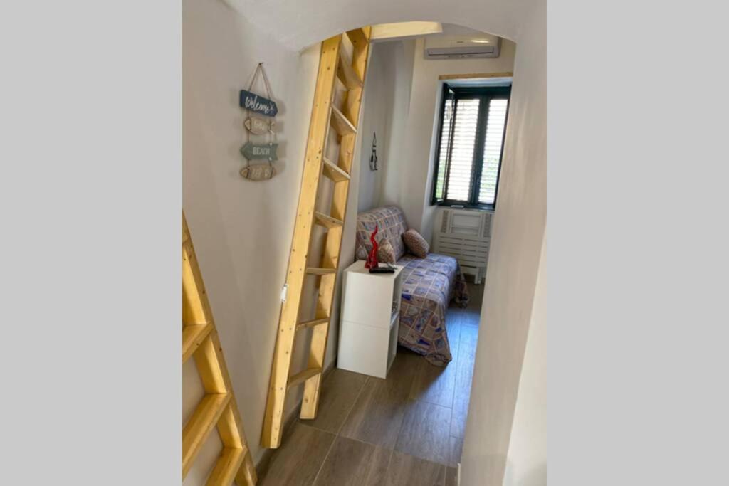 A bed or beds in a room at Sandro's Studio Vietri Center