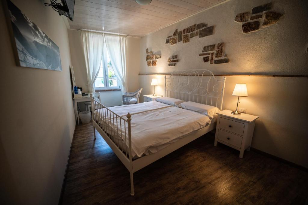 Een bed of bedden in een kamer bij Garni Gianmartin