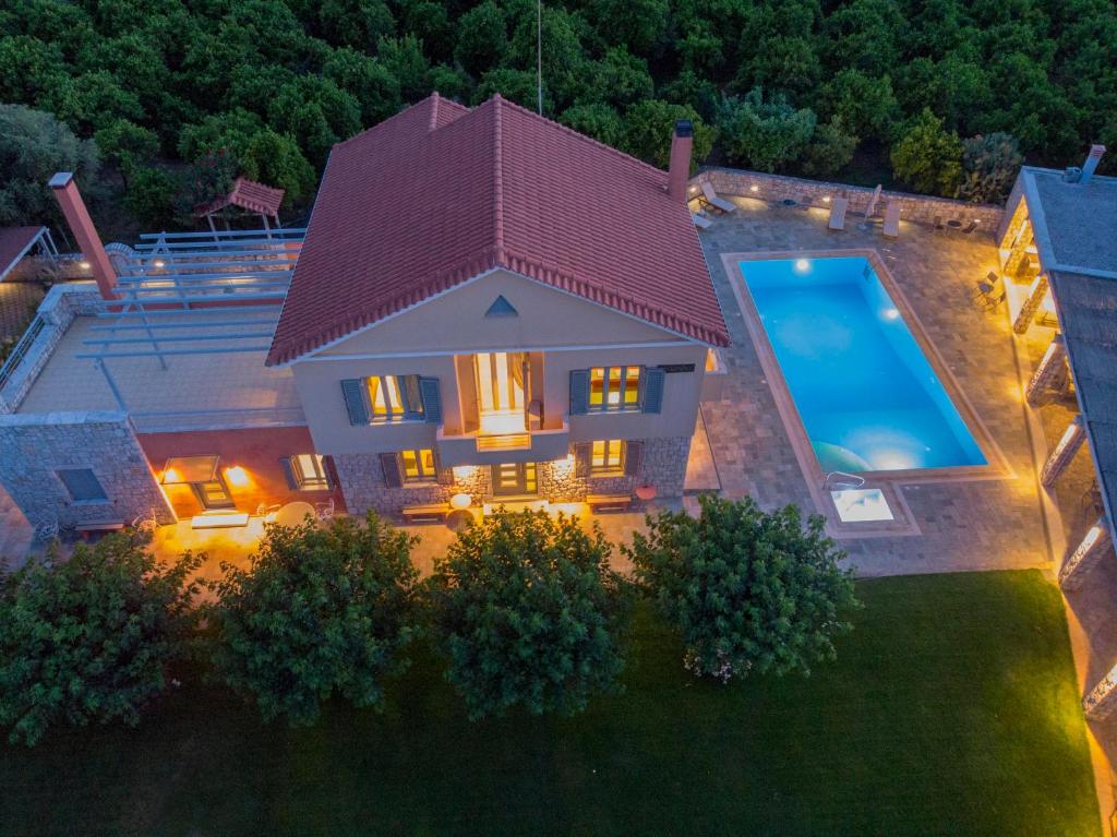 an overhead view of a house with a swimming pool at Villa Rodoula in Mystras in Sparti