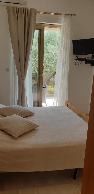 Łóżko lub łóżka w pokoju w obiekcie Apartments Cocaletto5