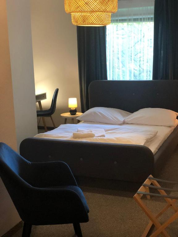Postel nebo postele na pokoji v ubytování Hotel Portus