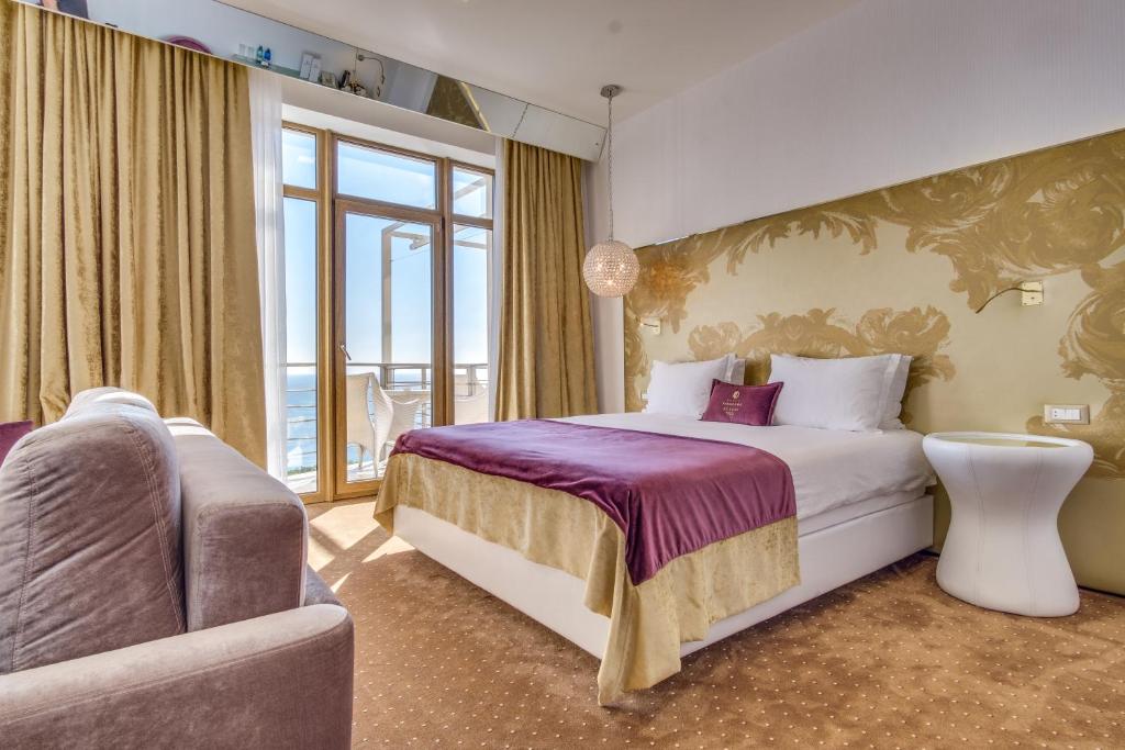 Postel nebo postele na pokoji v ubytování Hotel Panorama De Luxe