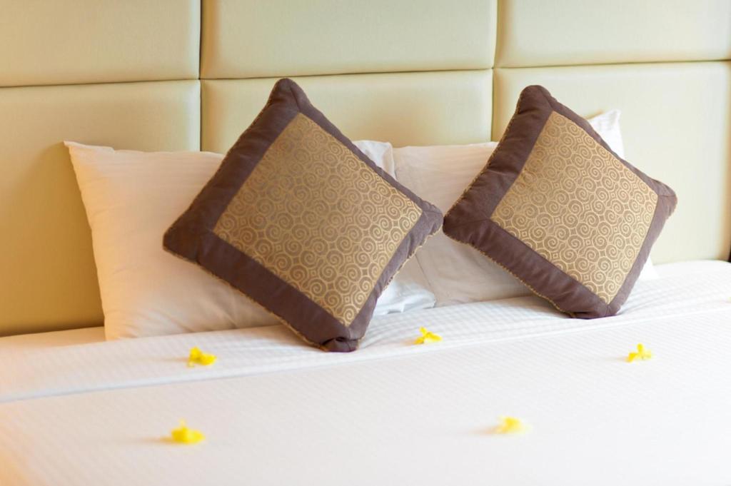 Postel nebo postele na pokoji v ubytování Brown Bean 2 Hotel