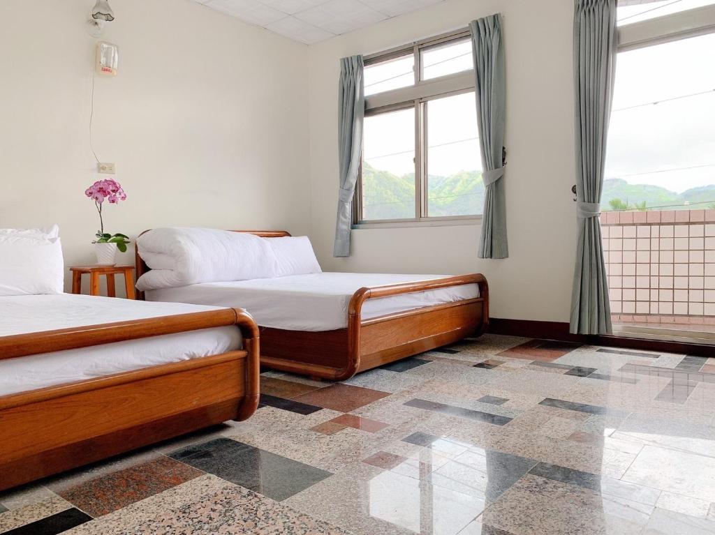 Postel nebo postele na pokoji v ubytování Youlin Homestay