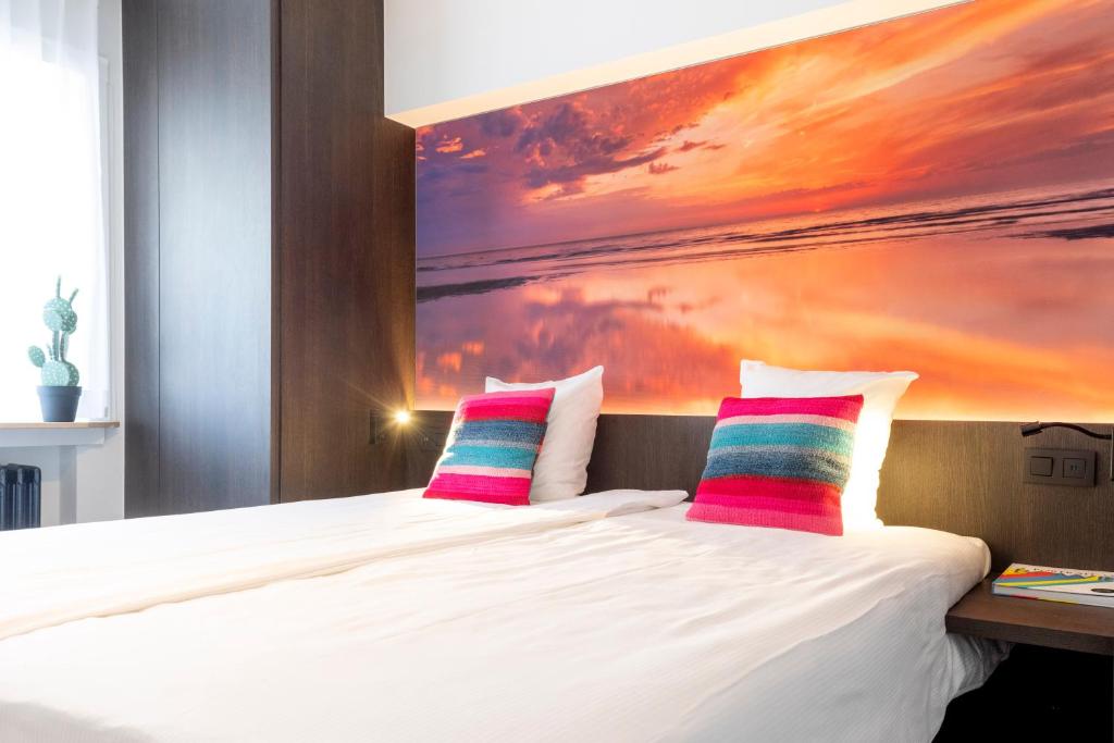 Postel nebo postele na pokoji v ubytování Hotel Nelson