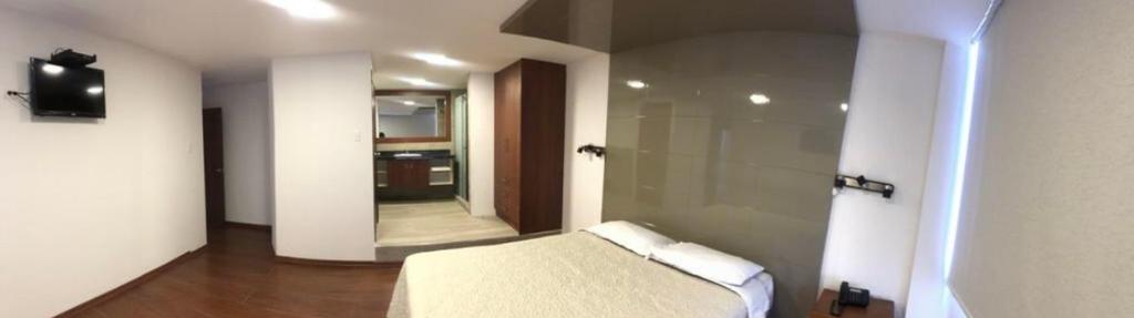 Postel nebo postele na pokoji v ubytování Hotel Bacastell