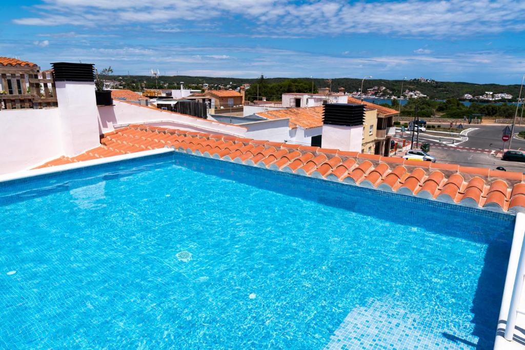 a swimming pool on the roof of a building at HOTEL SON VILAR in Es Castell
