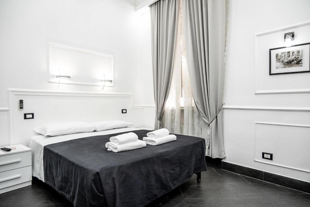 A bed or beds in a room at L'antica Locanda Dell'Orso