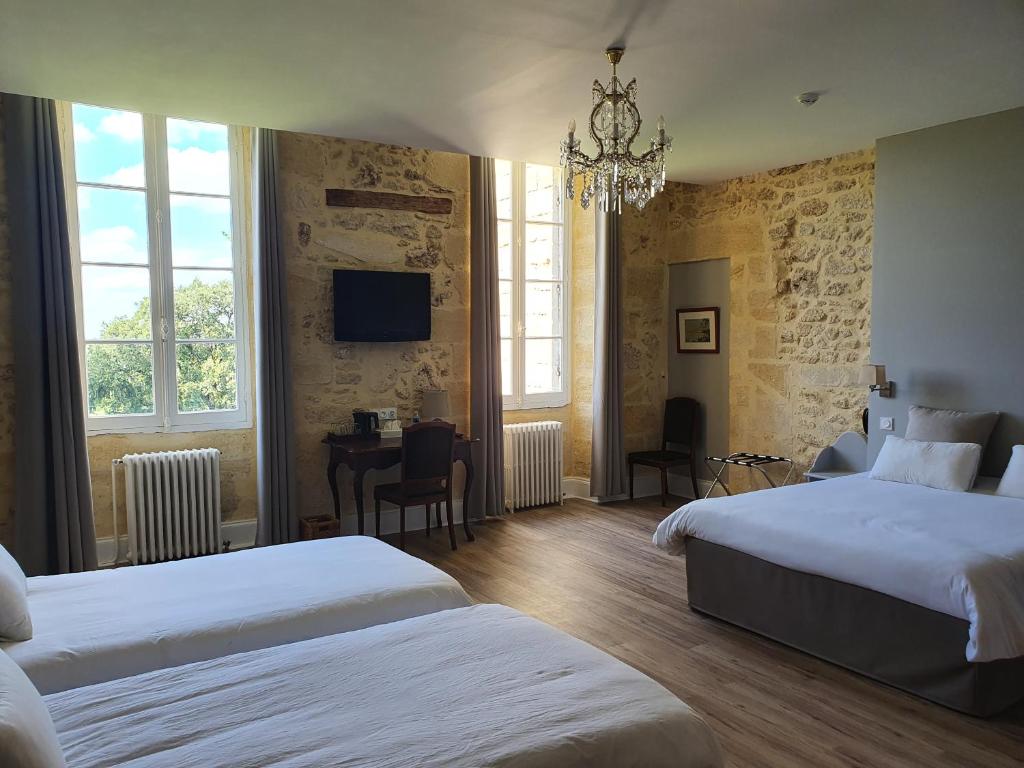 En eller flere senger på et rom på Château Fleur de Roques - Puisseguin Saint Emilion